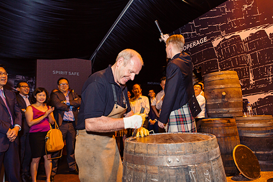 Head Cooper, Ian McDonald, demonstrating to guests one of the world's oldest craft of coopering