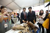 Dr Yi Zhang, Global Business Director, DuPont Protection Solutions and Mr Damian Chan, Executive Director, Energy & Chemicals, Singapore Economic Development Board inspect the DuPont™ Nomex® garment after the live burning demonstration